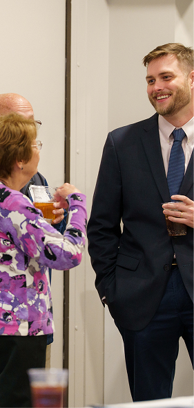 InFocus Financial Advisors team member engaging with clients at a retirement planning event