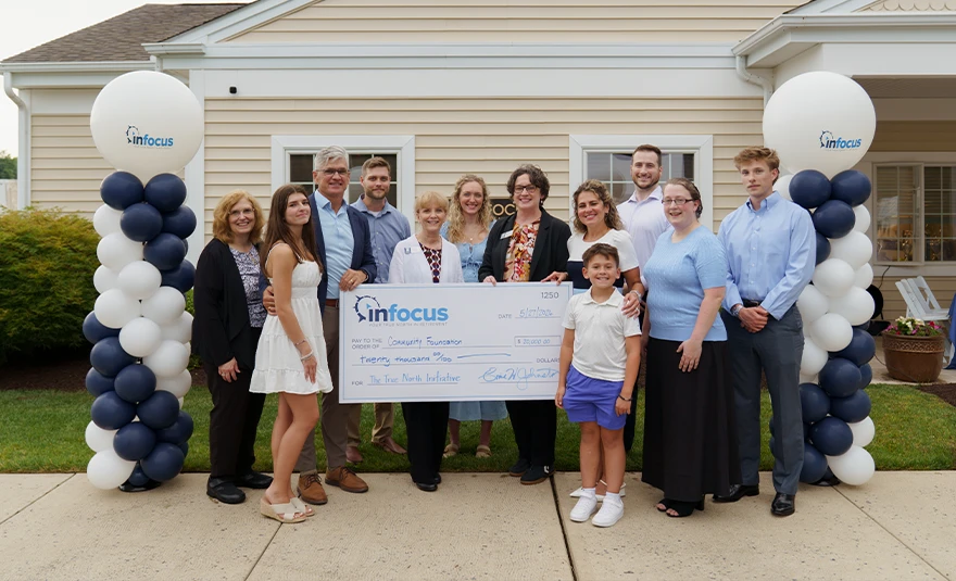 InFocus team presenting a ceremonial check to the Community Foundation for The True North Initiative